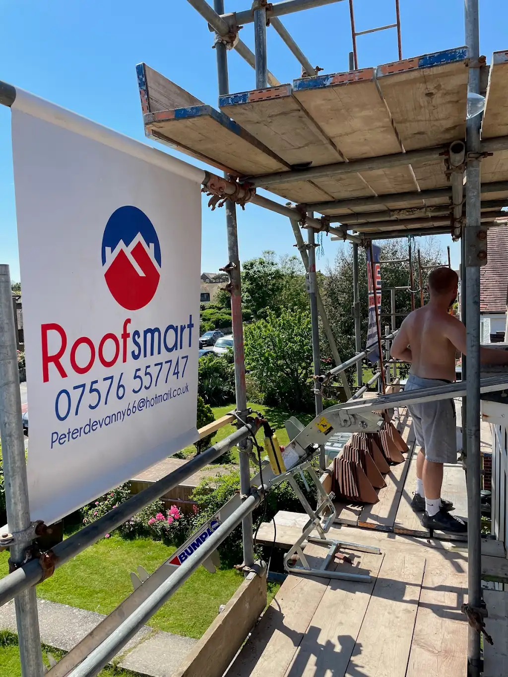 Roofsmart Sussex branded signage on scaffolding at an East Sussex roofing job